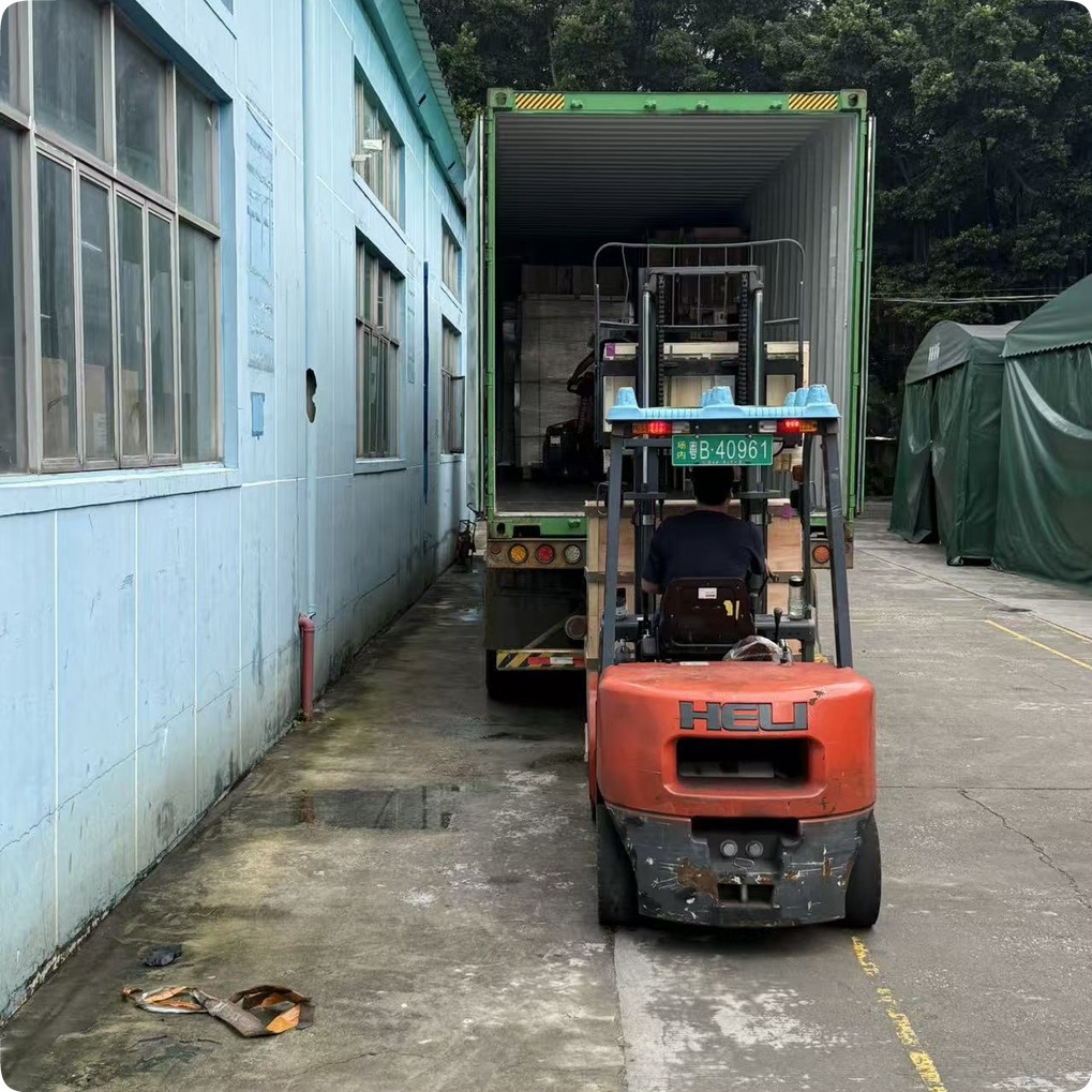 Forklift loading cargo into a container